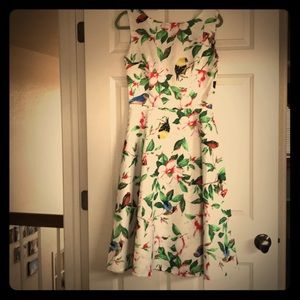 Beautiful dress with flowers and bird designs.